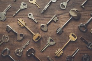 Overhead,Of,Many,Different,Keys,In,Oder,On,Wooden,Background